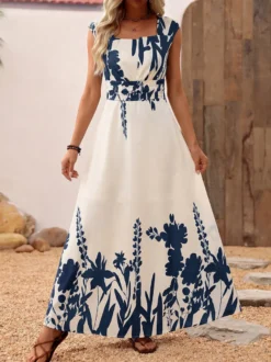 Robe d'été bohème bleu foncé à imprimé floral col carré sans manches fluide style bohème idéale pour la plage.
