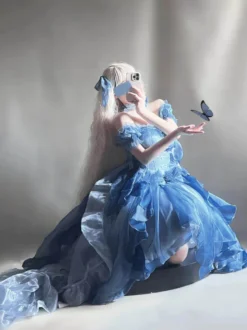 Robe Lolita Fée Bleue coupe asymétrique jolis nœuds dos nu bretelles bandage et volants