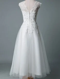 Robe mariée courte col rond en dentelle pailletes jupe en tulle zip sur dos Robe de mariage