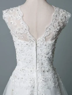 Robe mariée courte col rond en dentelle pailletes jupe en tulle zip sur dos Robe de mariage