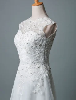 Robe mariée courte col rond en dentelle pailletes jupe en tulle zip sur dos Robe de mariage