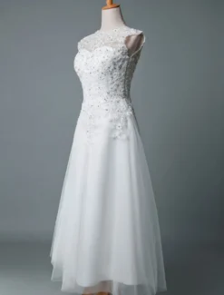 Robe mariée courte col rond en dentelle pailletes jupe en tulle zip sur dos Robe de mariage