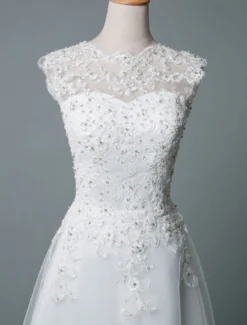 Robe mariée courte col rond en dentelle pailletes jupe en tulle zip sur dos Robe de mariage