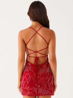 Robe orange cintrée et élégante ornée de sequins floraux parfaite pour les fêtes