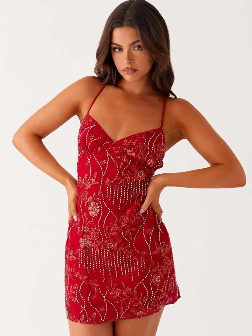 Robe orange cintrée et élégante ornée de sequins floraux parfaite pour les fêtes