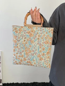 Sac cabas vintage à imprimé floral et anses en bambou grande capacité en toile porté épaule.