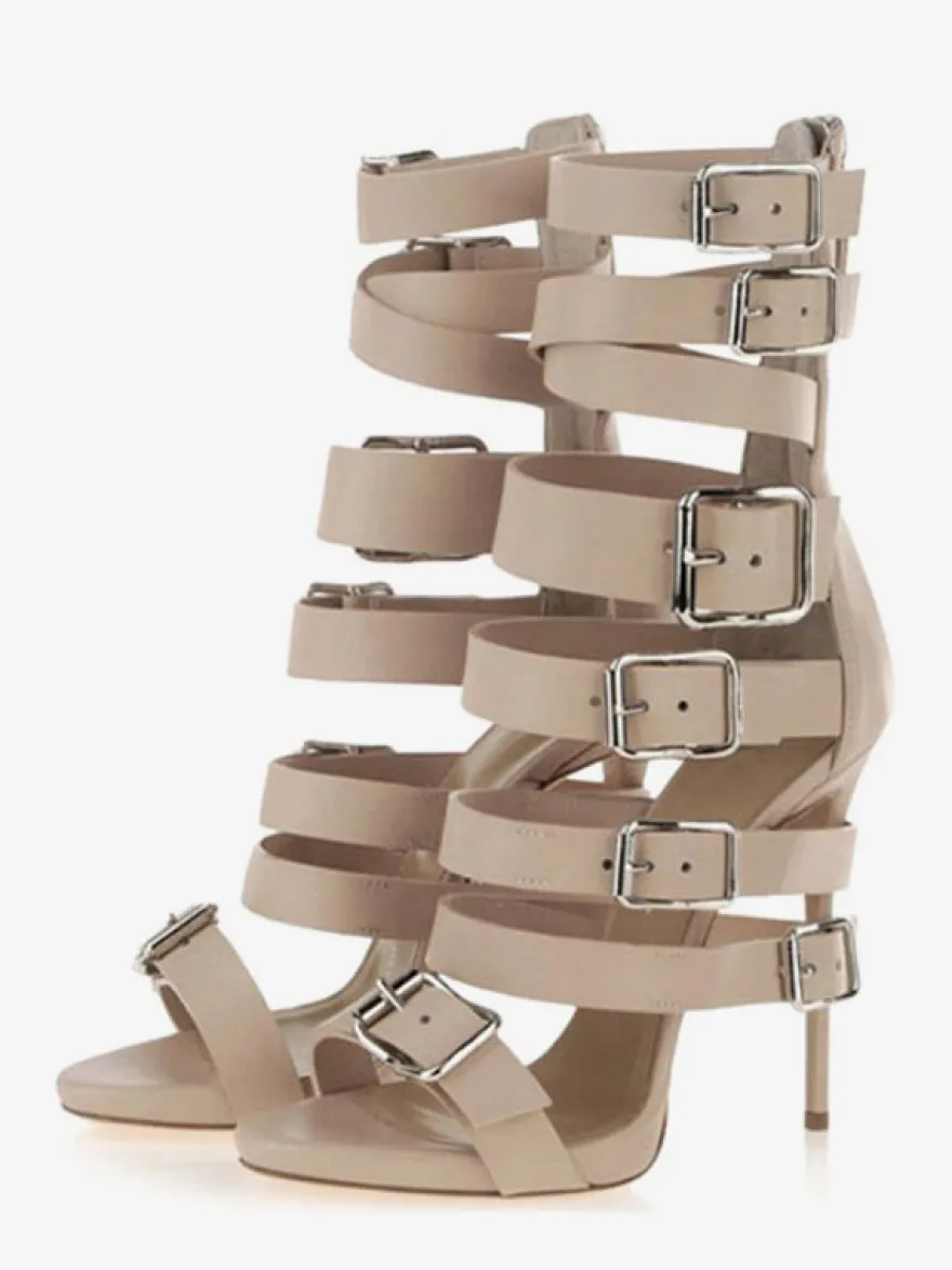 Sandales gladiateur noires à talons hauts et bout ouvert ornées d'une boucle.