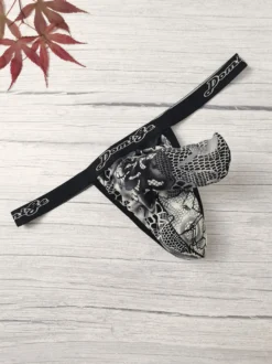 String pour homme en dentelle florale argentée avec poche en maille transparente et sous-vêtement sexy et élastique