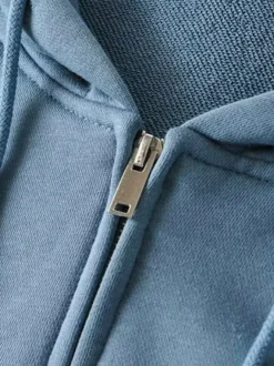 Sweat à capuche zippé à cordon de serrage manches longues coupe ample style décontracté pour femme